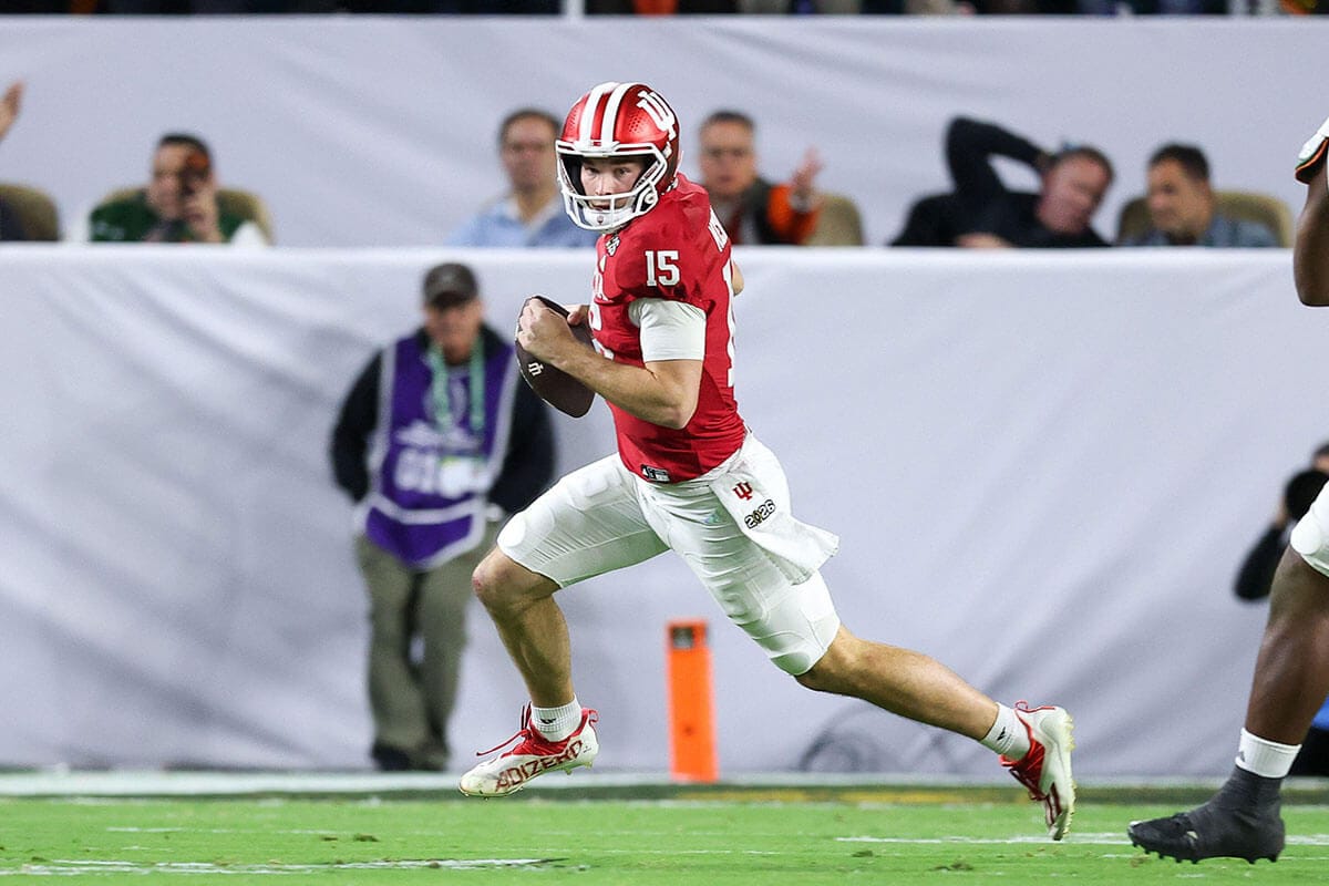 Indiana Hoosiers quarterback Fernando Mendoza scrambles during the 2026 CFP National Championship game against the Miami Hurricanes at Hard Rock Stadium in Miami Gardens, Florida.